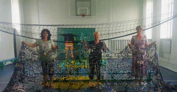 Ukrainian women building nets for protection